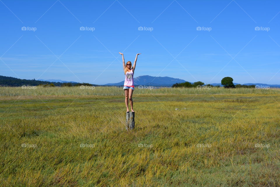 Woman Posing on a Stump in a Field, Model, Blonde, Summer, Island, Victoria BC Canada 