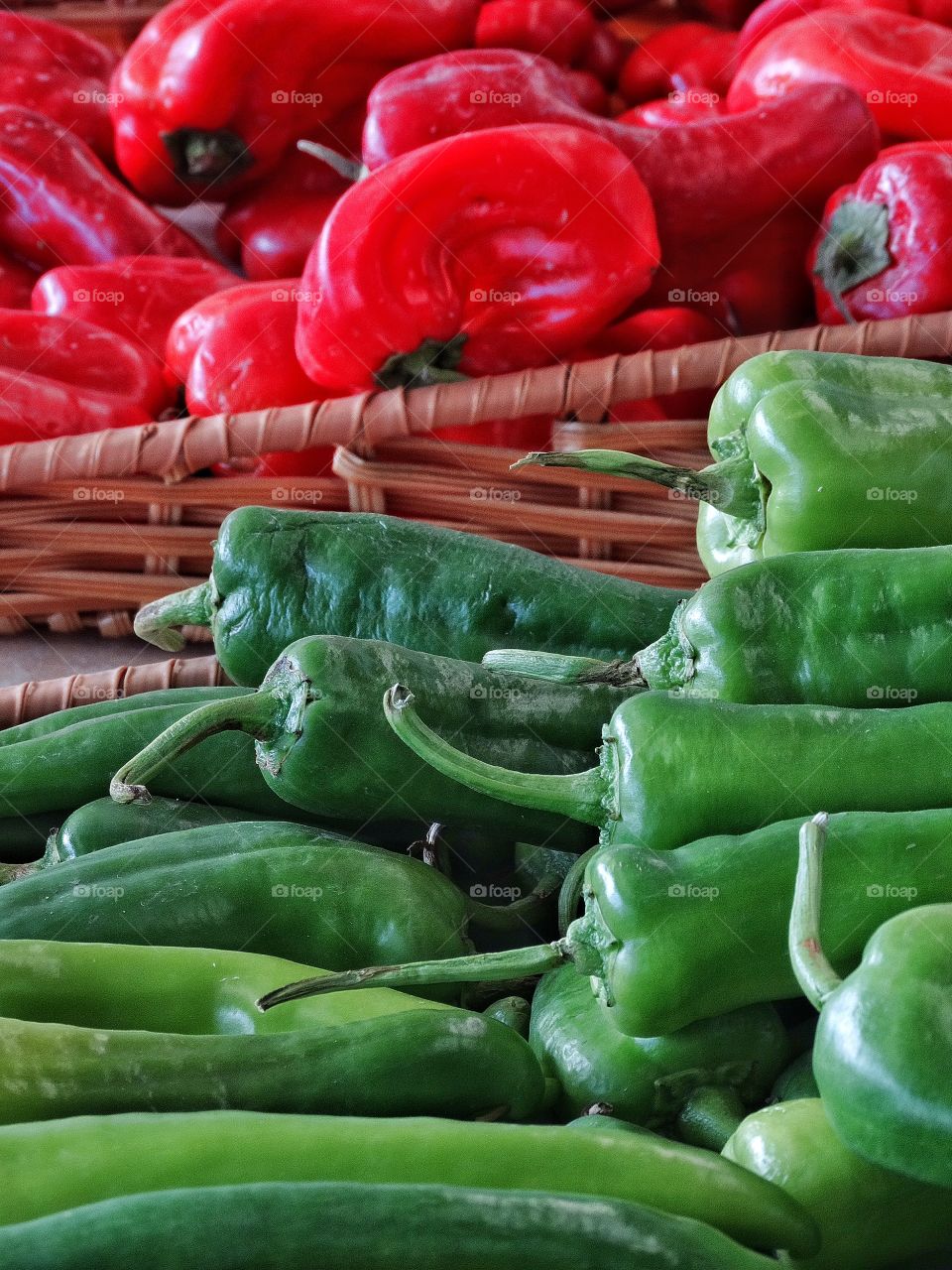 Fresh Red And Green Peppers. Fresh Organic Bell peppers On Display At A Farmer's Market
