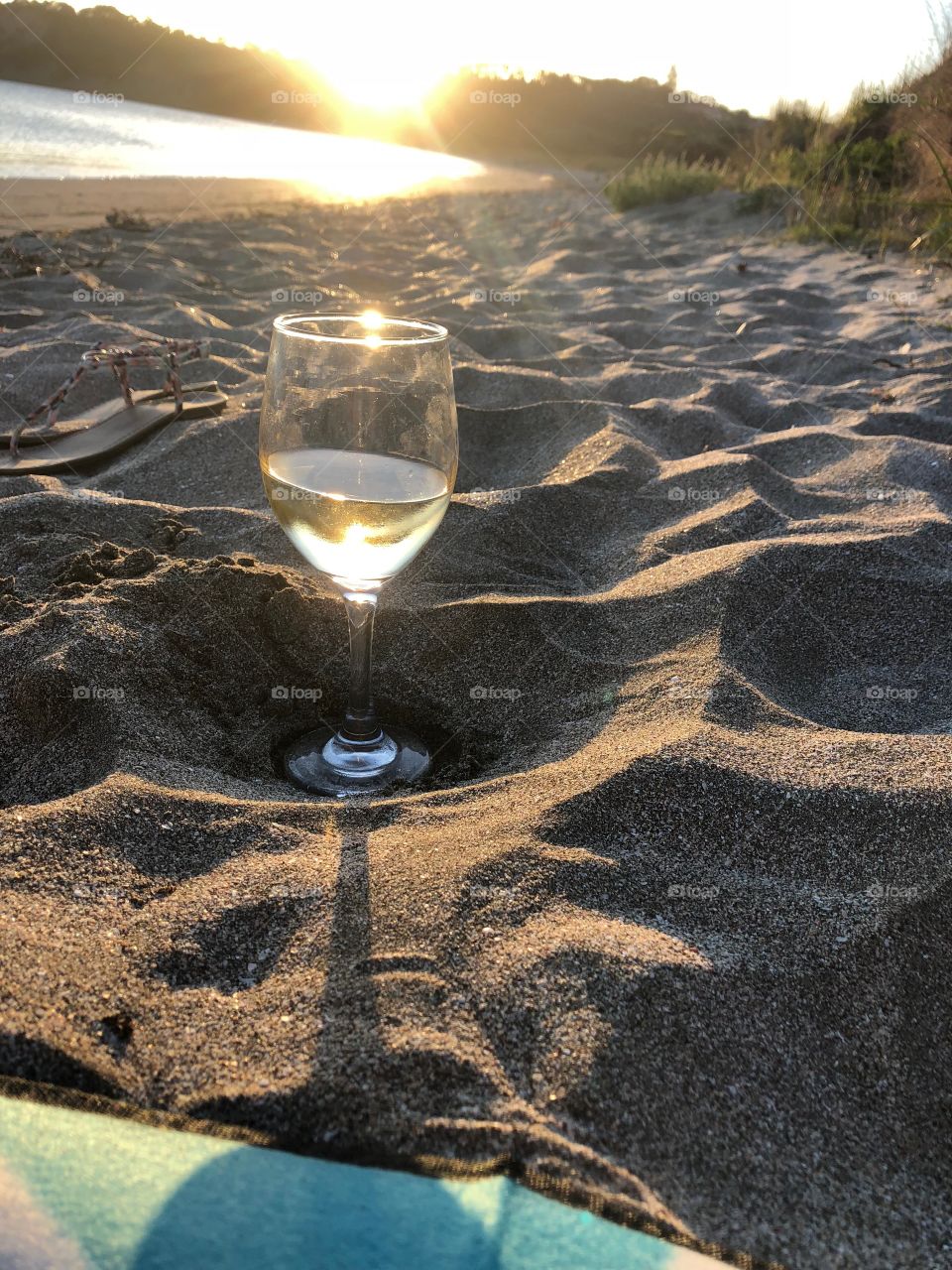 Watching the sunset with my feet in the sand and a glass of wine. What more could a girl ask for!