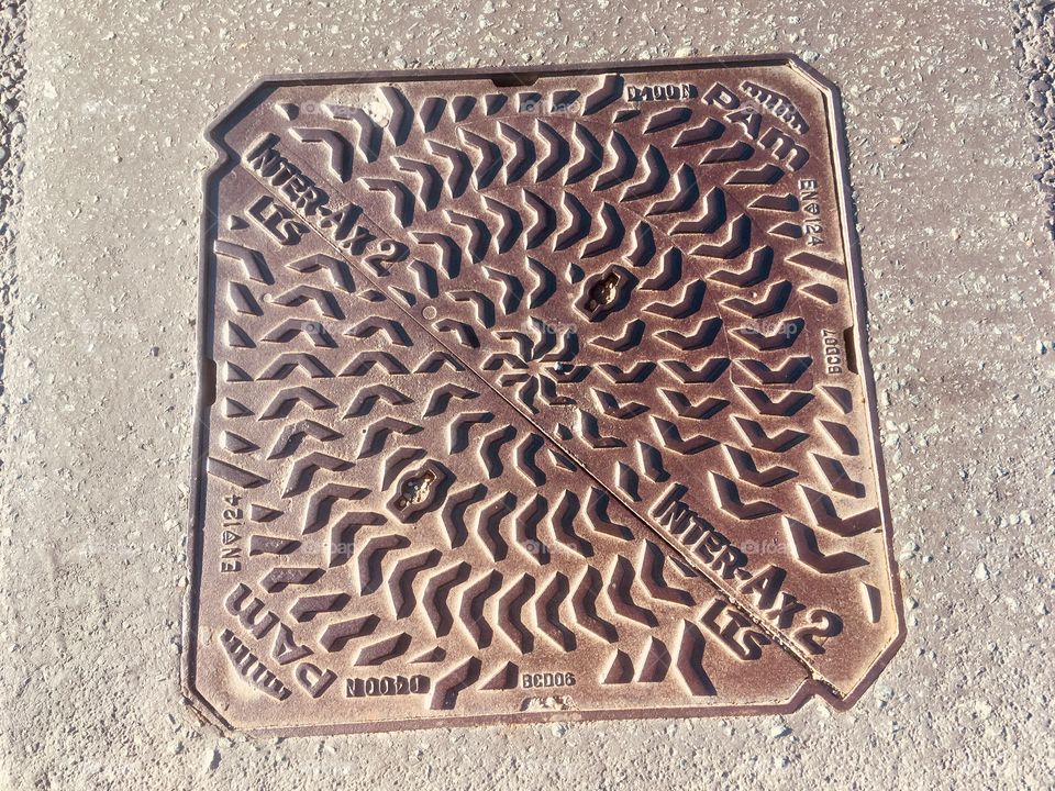 Inter-AX2 iron lift out cover, at the side of the A41 dual carriageway in Edgware, Middlesex
