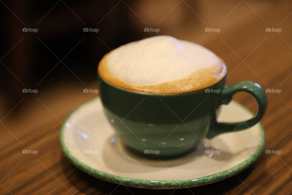 Cappuccino on the table , making the morning delightful 