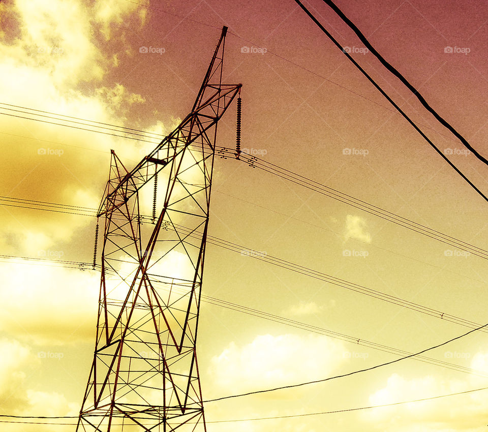 Golden Wired Sky. Electricity pylon and sky with gold filter