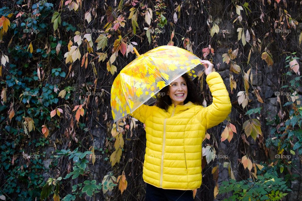 Smiling Young Girl on Autumn Background