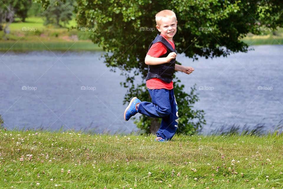 Happy running boy