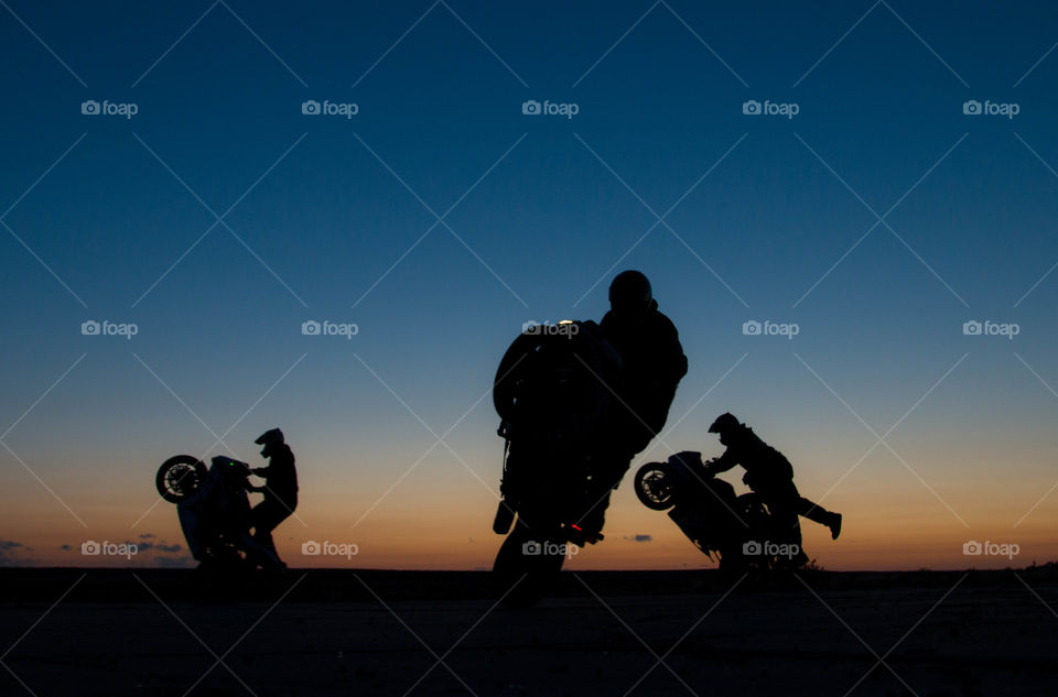 wheelies at sunrise. the guys wheeling in new mexico during early morning sunrise