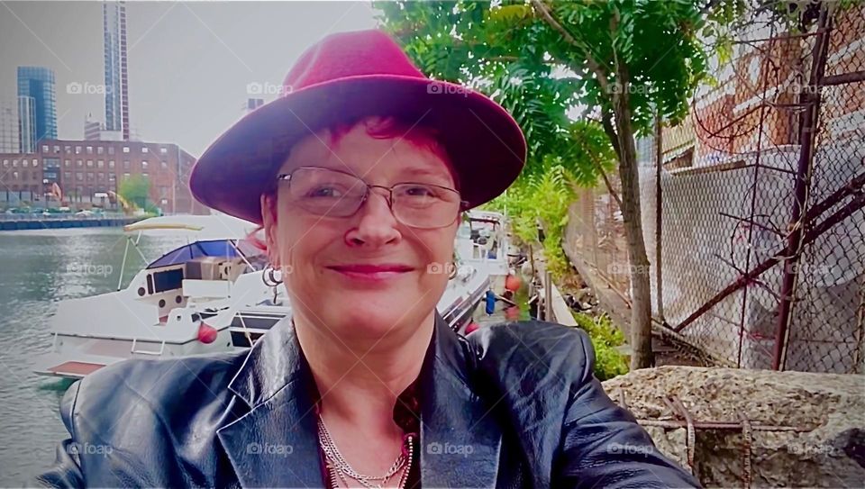 This is me, „Petra Schiller“ smiling ecstatically to myself while standing in the parking lot underneath the „Pulaski Bridge“ at „Newtown Creek“ in LIC, Queens, NY on a beautiful Fall day in 2022. Hypnotic Productions