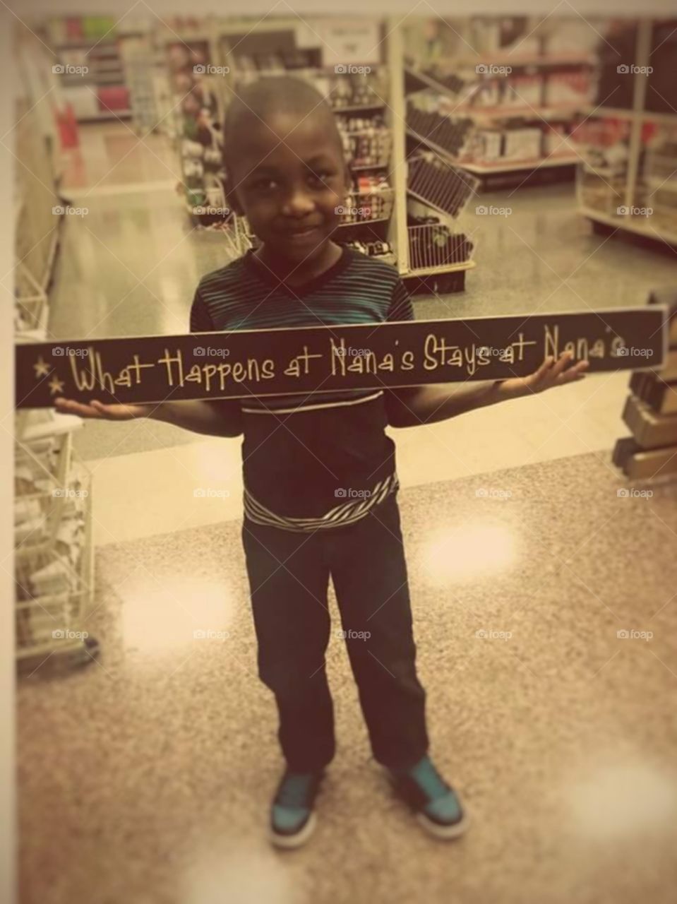 Boy Holding Sign