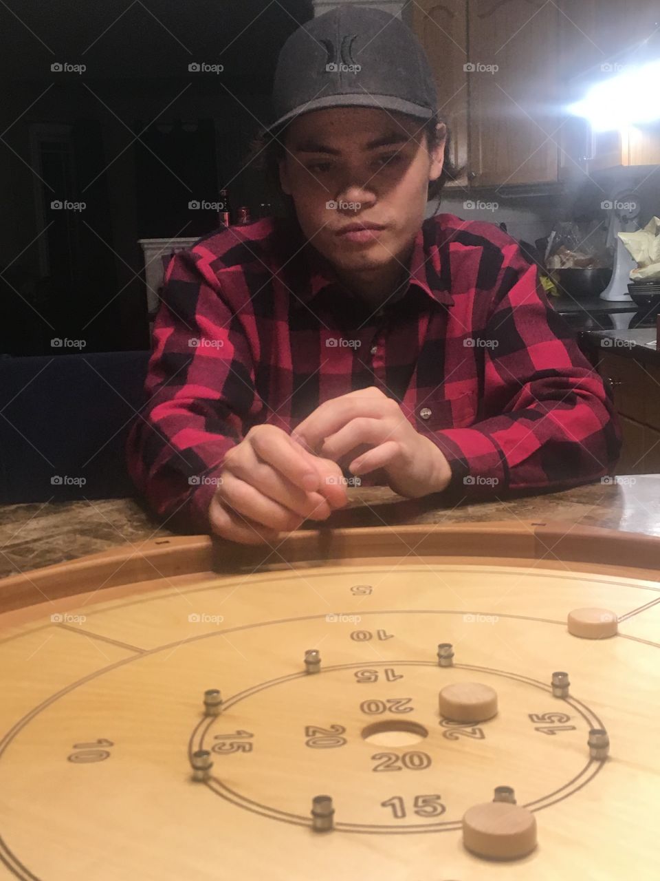 Playing crokinole 