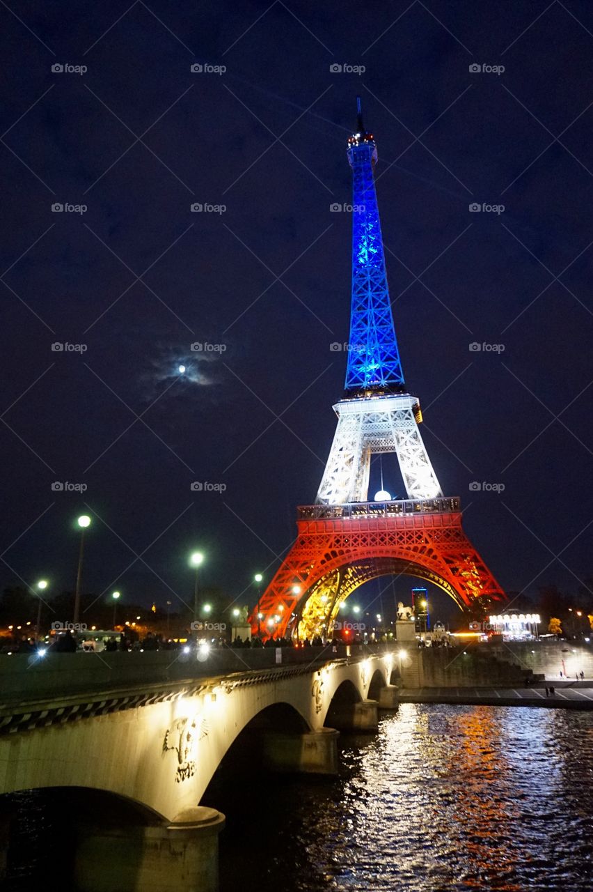 The Eiffel Tower lit up after the Paris attacks, Nov 2015