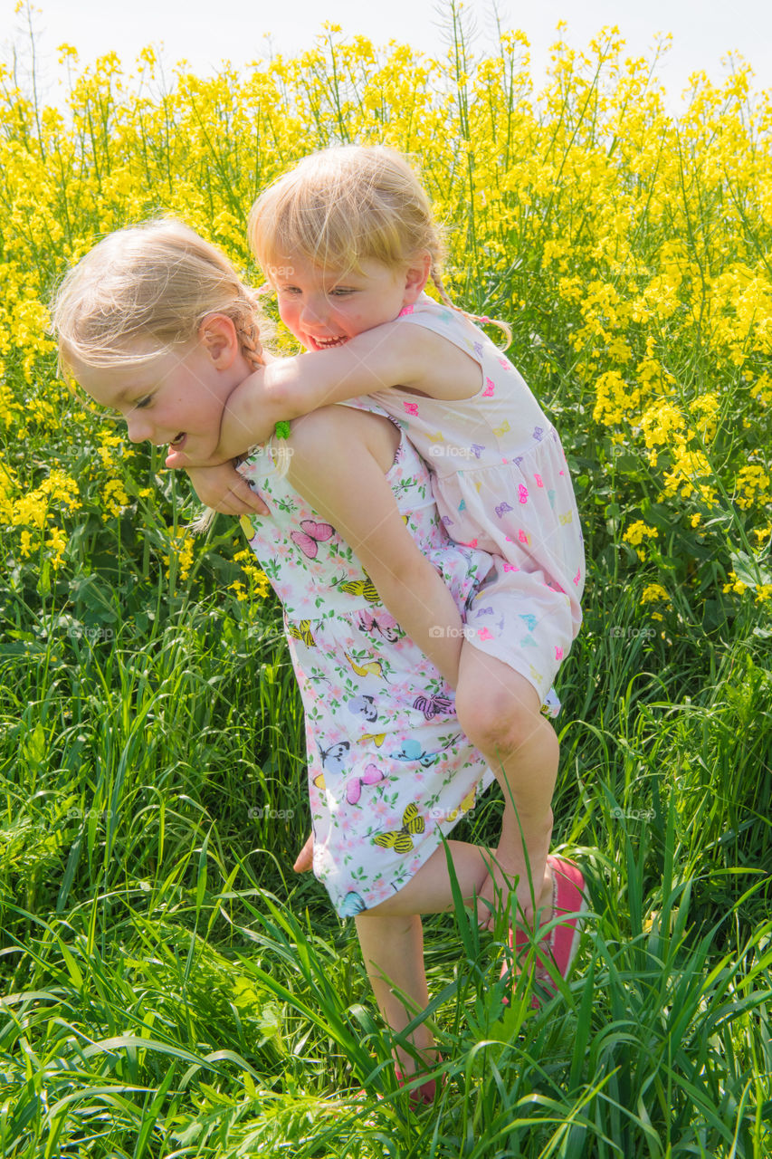 Two young sisters are playing in the Raps field outside the city Malmö in Sweden.