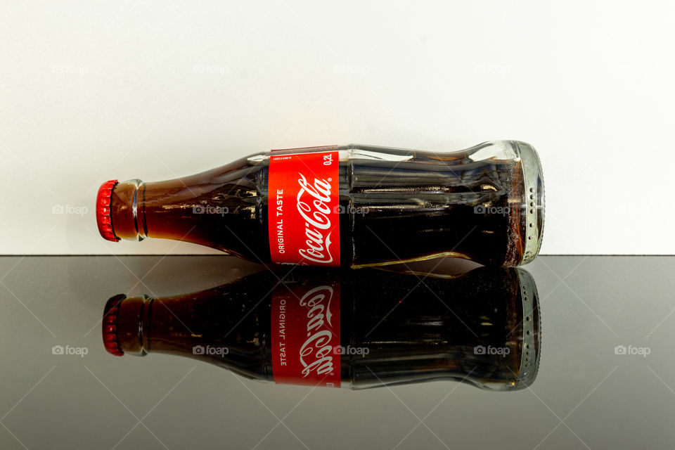 reflection of a bottle Coca-Cola