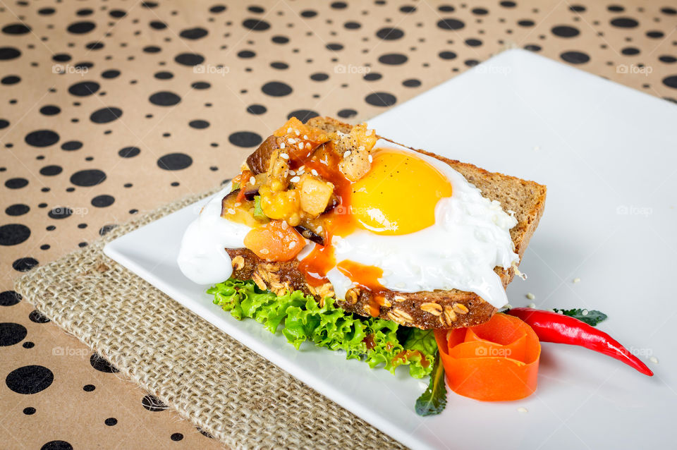 Homemade sandwiches with eggs topping 
