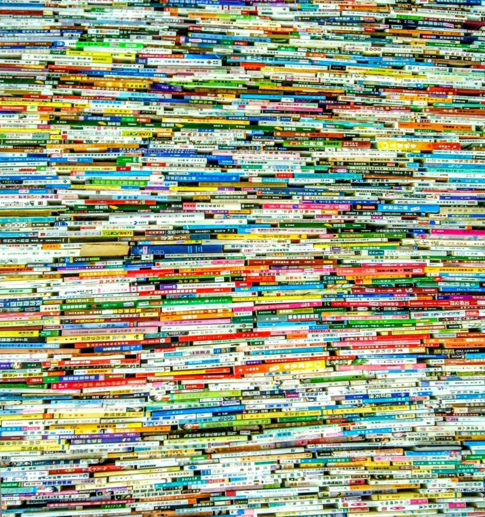 Many books in library's wall,  looks like an art of books.