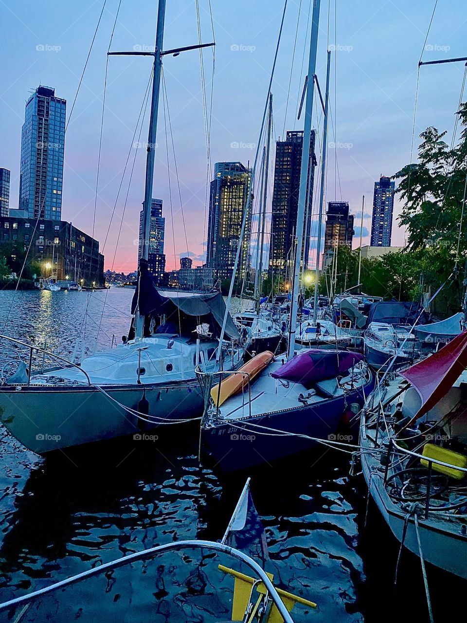 “Newtown Creek” by the “Pulaski Bridge” in LIC, Queens offers the most spectacular views. All kinds of boats are here for a special allure that is even more striking when the setting sun turns the sky pink at twilight time. 2023. Hypnotic Productions