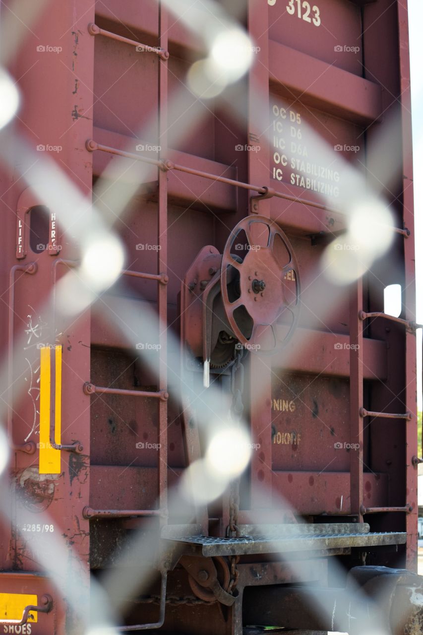 train car through chain link fence