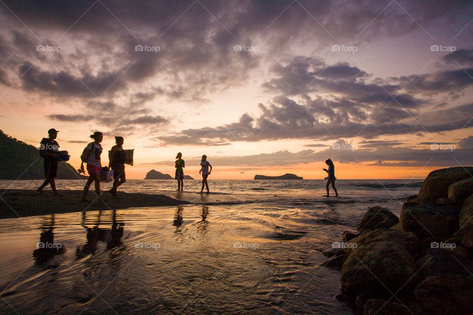 walking on a sunset beach