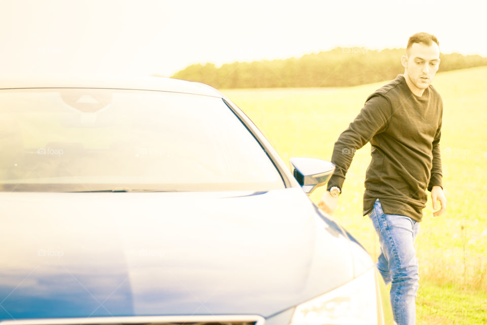 Man closing the car door