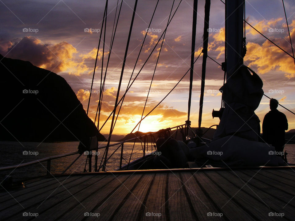 sunset at a sailing ship before the coast of Norway 