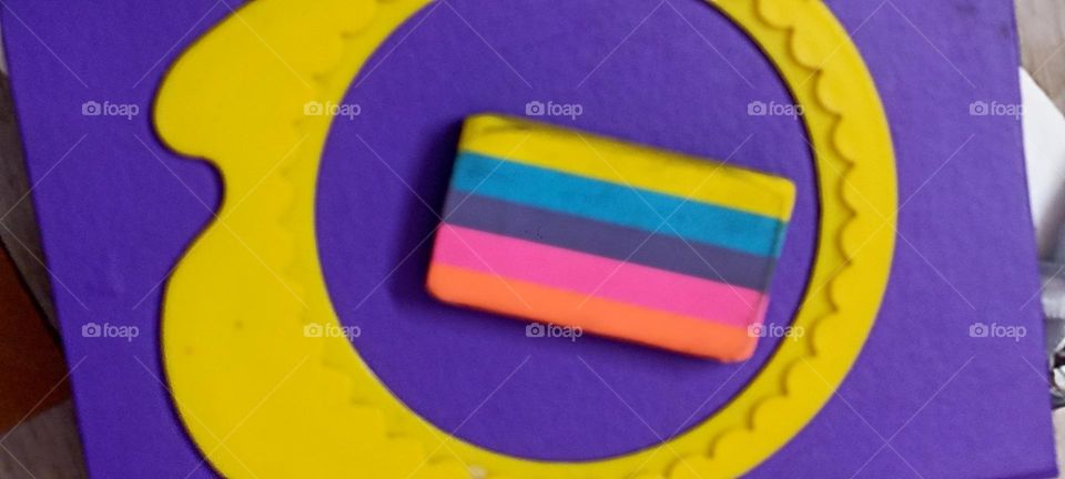 rainbow colors on my table with a purple background .