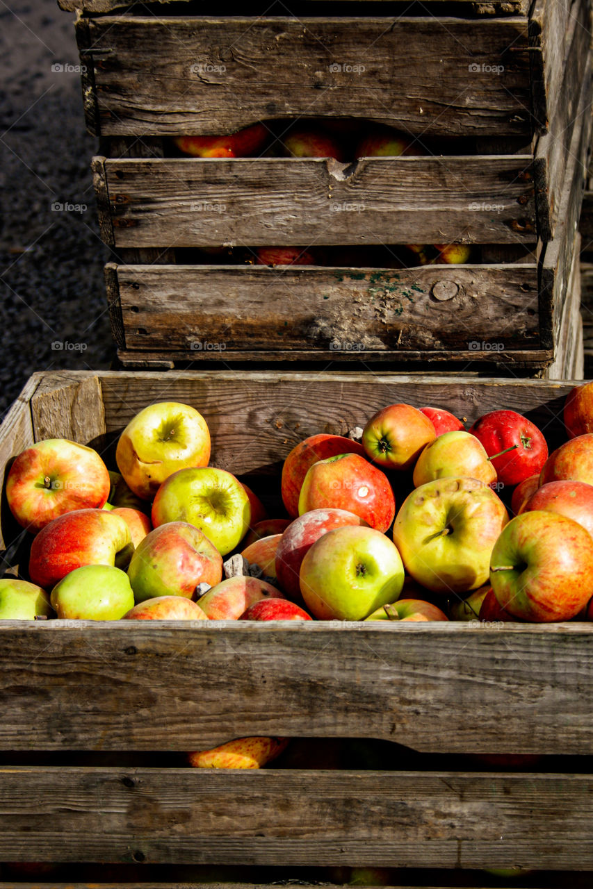 red apples in wooden boxes