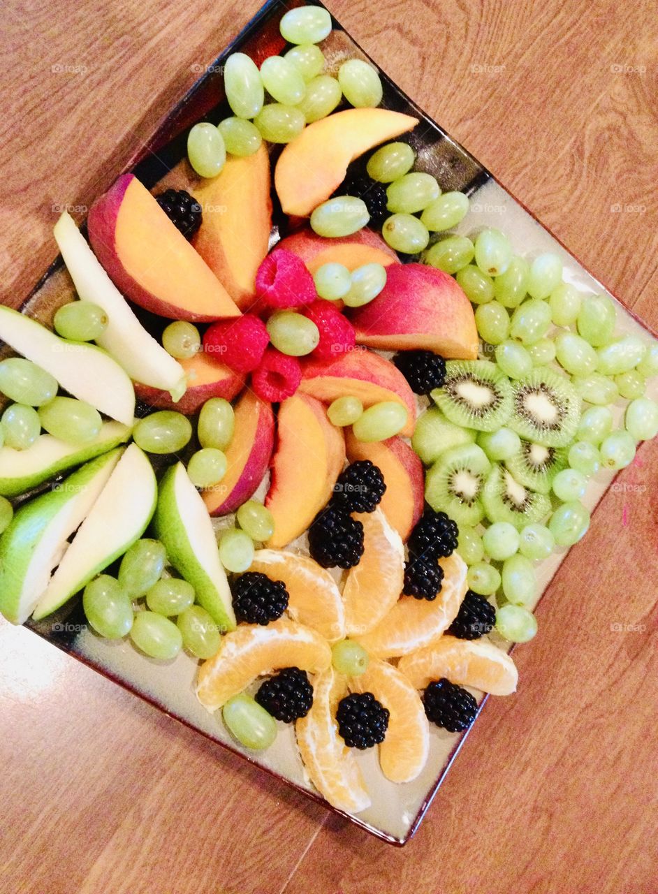 Gorgeous plate of mixed fruits of all colors makes for a delicious afternoon snack or compliments any meal! 