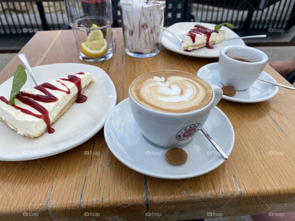 Cup of cappuccino with delicious cake 