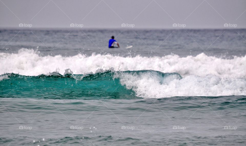 surfing on famara beach on lanzarote canary island in Spain