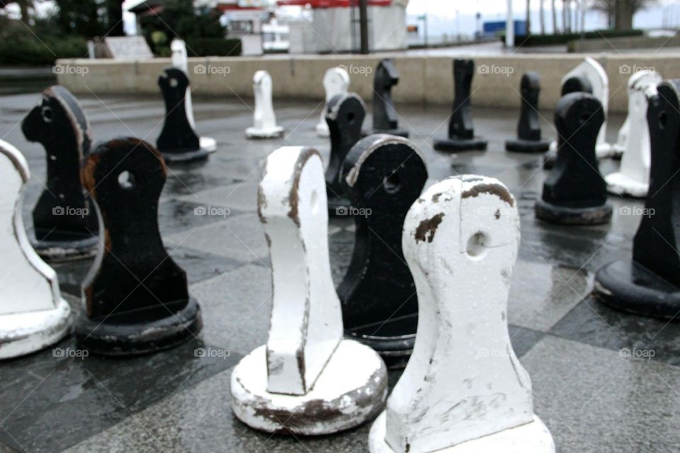 Chess Match . oversized chess game on a rainy day