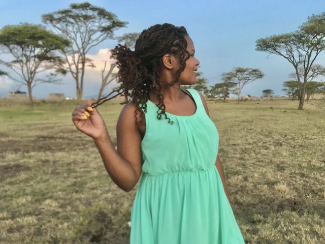 Field one person sky hairstyle Land Hair Nature landscape Standing Plant day young adult environment casual clothing front view Tree Agriculture waist up long hair beautiful woman in Kalimoni, Kenya