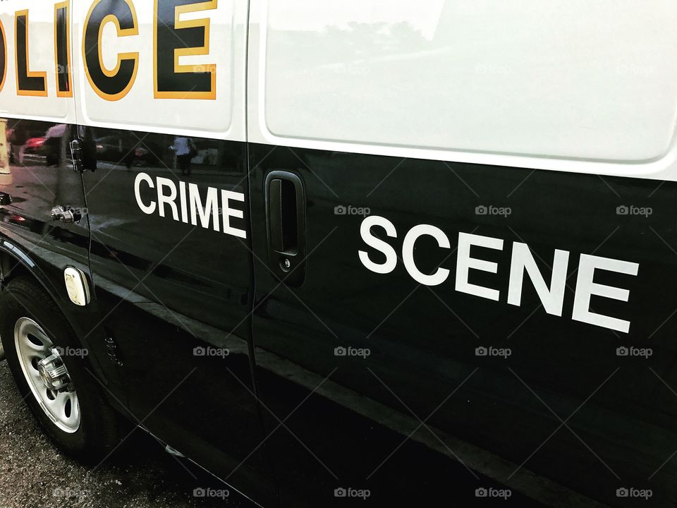 Close up of a police crime scene investigation vehicle. Contrasty police van with the words crime scene in black and white. 