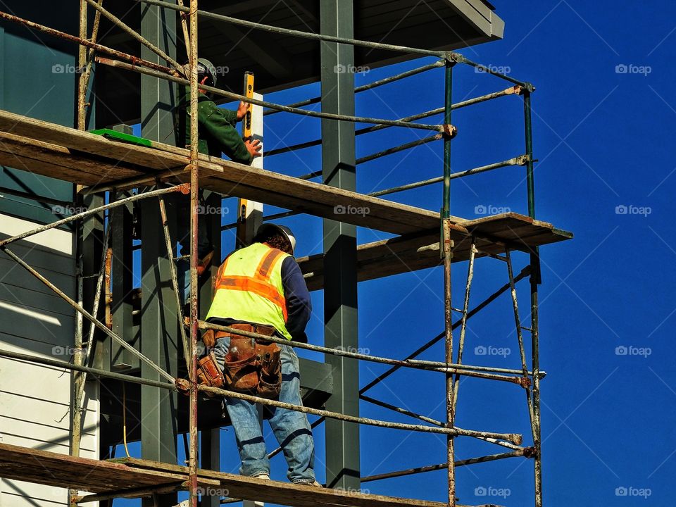 Construction Engineer. Worker on high rise building