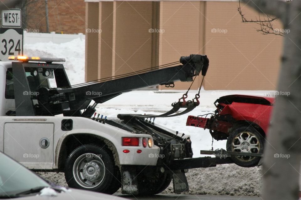 tow truck towing a car