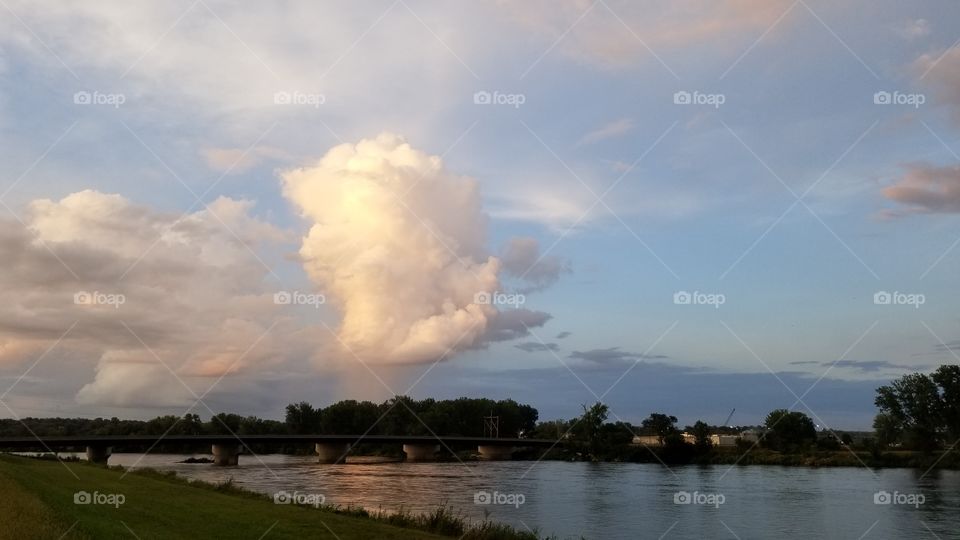 summer cloud over river