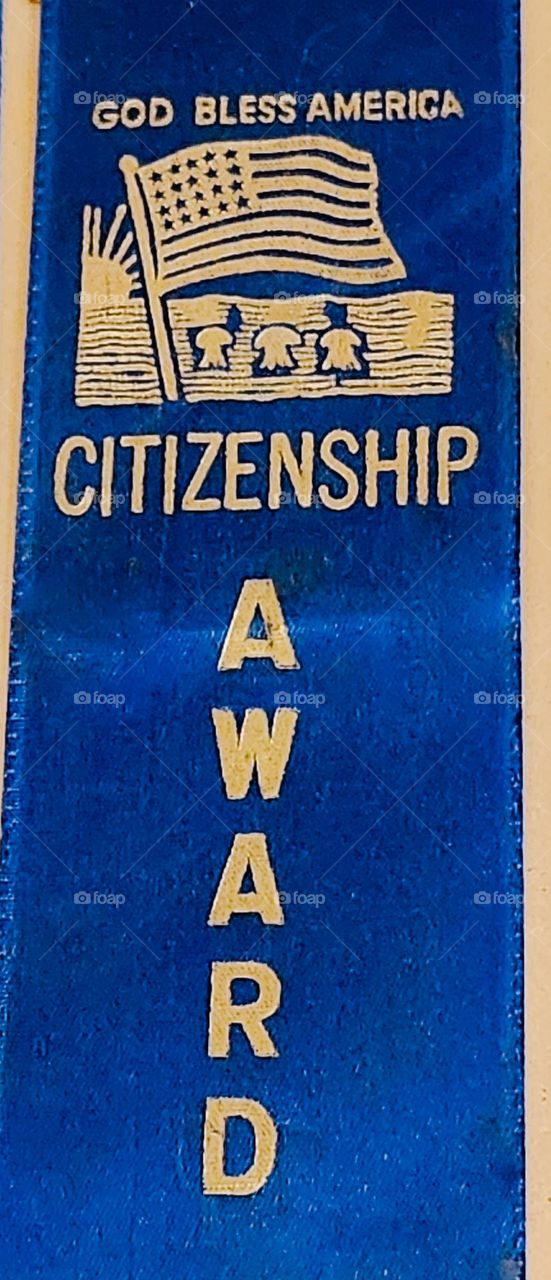 blue and gold American citizenship award ribbon given out in U.S. elementary schools for positive interactions with other people