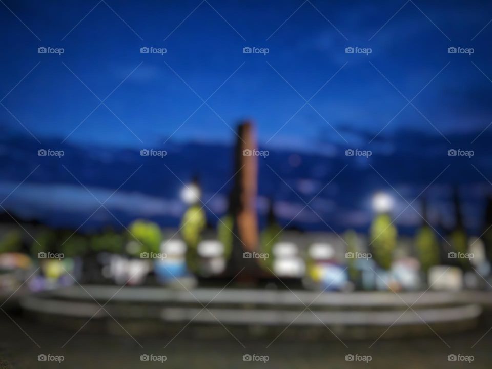 Defocused background abstract of dusk sky view in city park