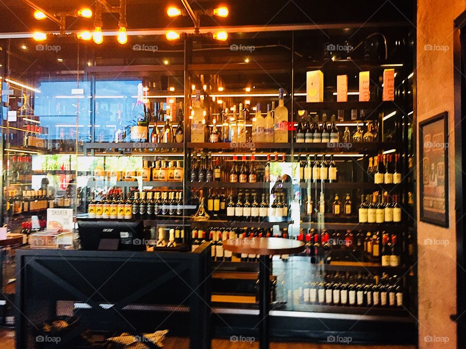 Wine and alcohol showcase in restaurant bar