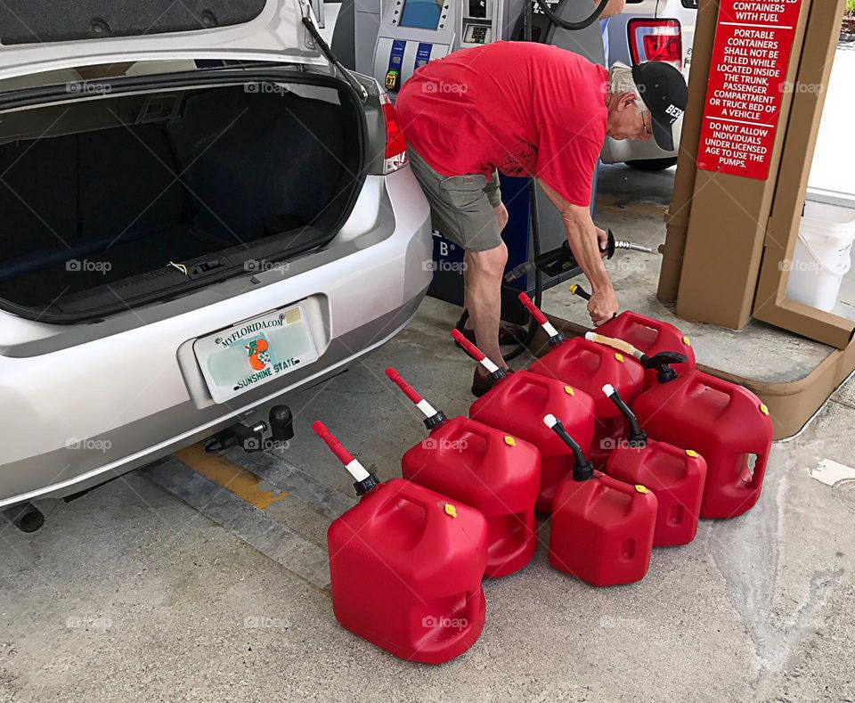 Man stocking up on gasoline.