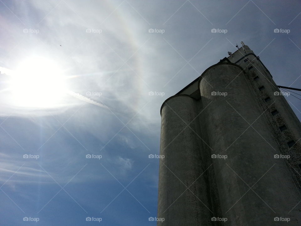 Sun, silo and blue sky