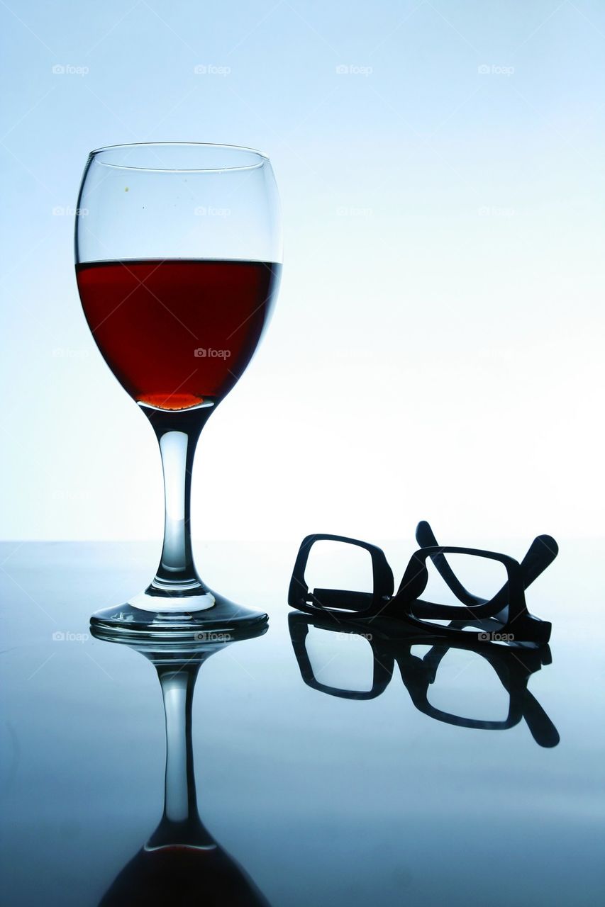 alcoholic drink and a pair of eyeglasses