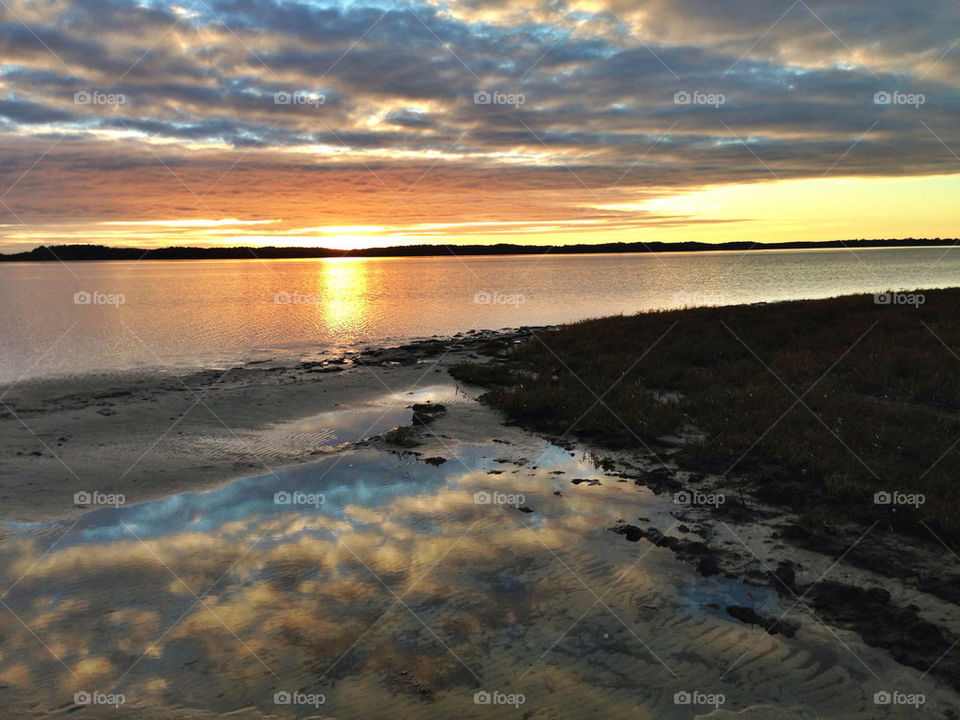 Cloud reflections at sunset