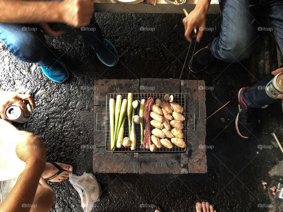 Barbecue as a past time on a rainy day.