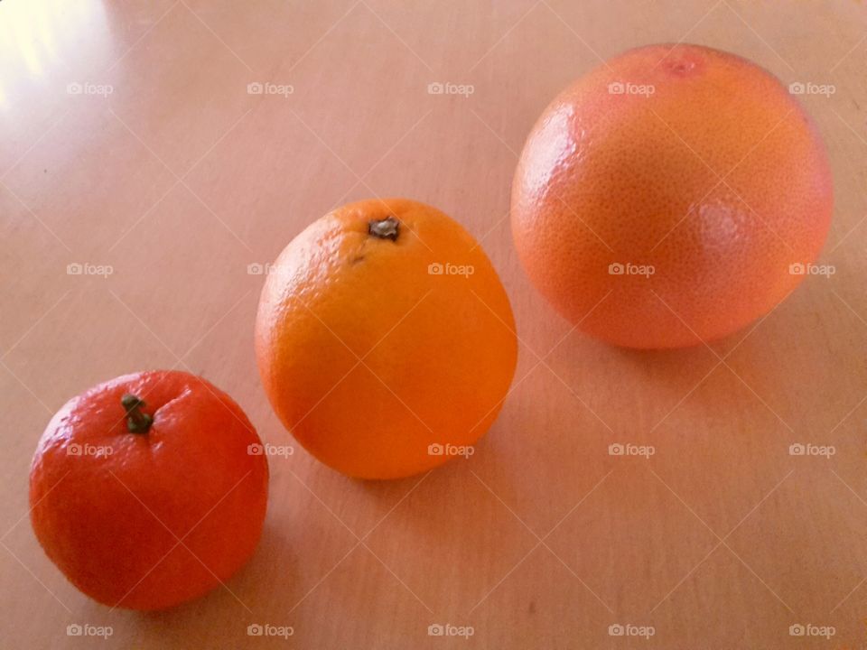 fruits -satsuma, orange and grapefruit