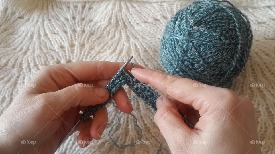 Close-up of women knitting