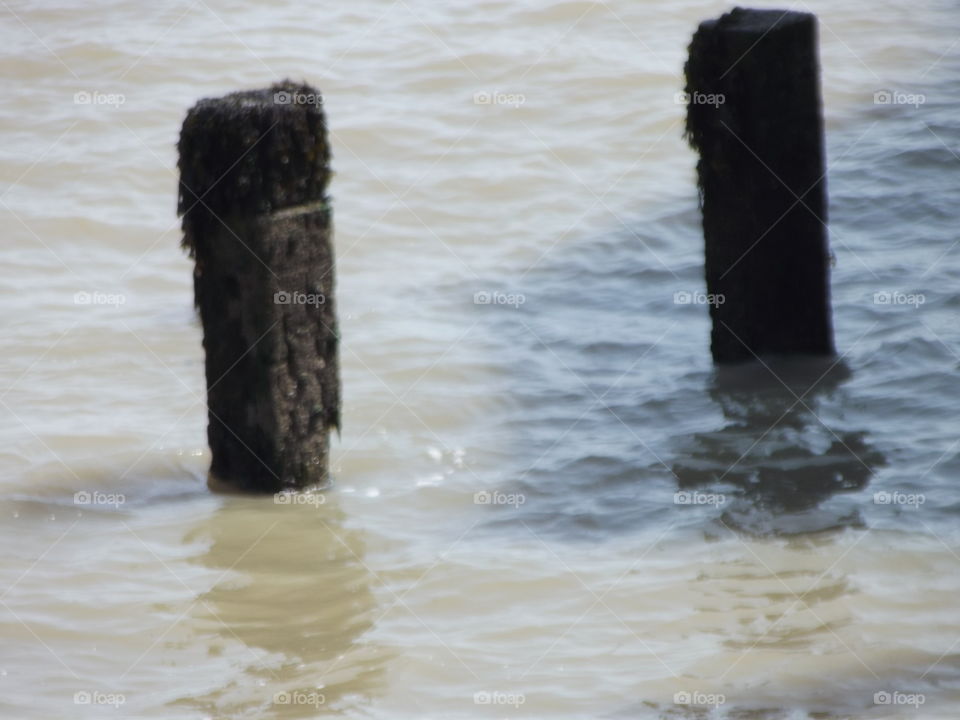 Two Posts In The Sea