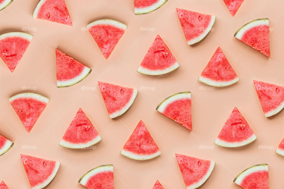 Sliced watermelon on orange background 