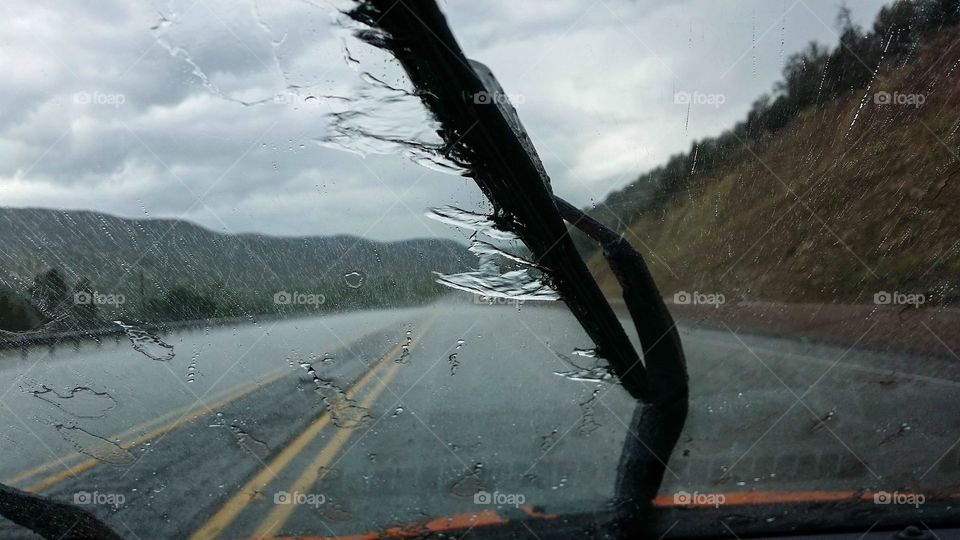 Driving through the mountains in heavy rain 