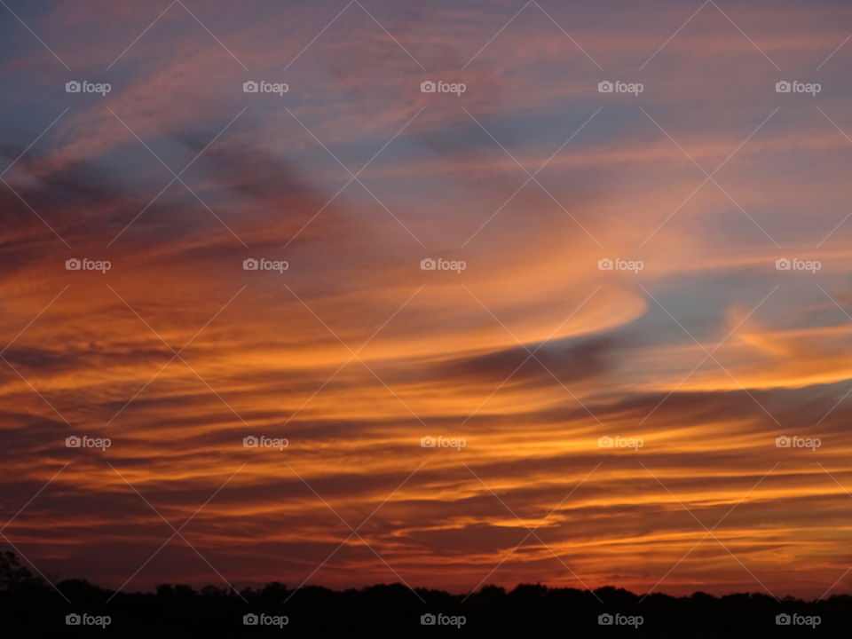 The red sunset with clouds.