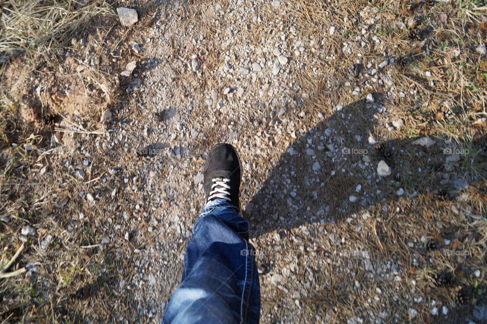 My foot in forest road