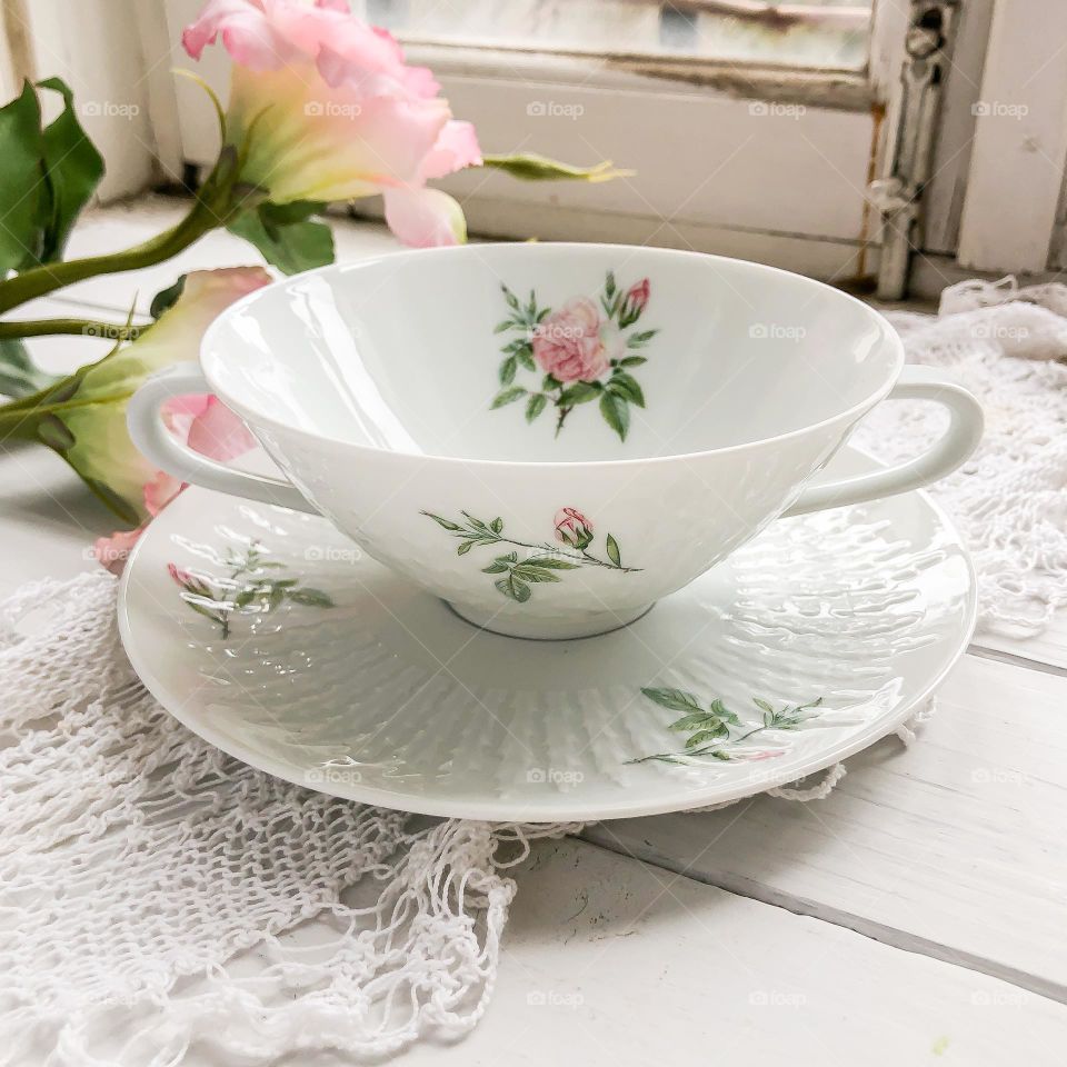 Vintage porcelain bouillon cup and saucer with roses