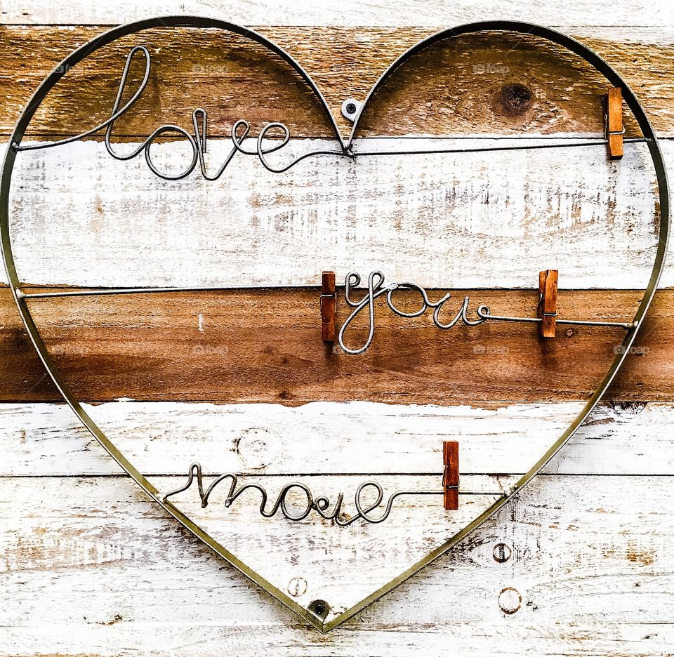 Love text against wooden background